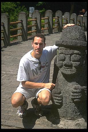 on Cheju Island next to a 'stoned grandfather'